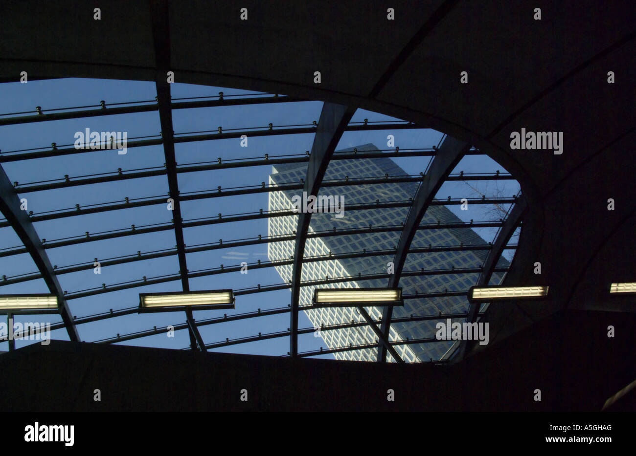 Canary Wharf London roof of Tube station and view through glass to 40 Bank Street Stock Photo