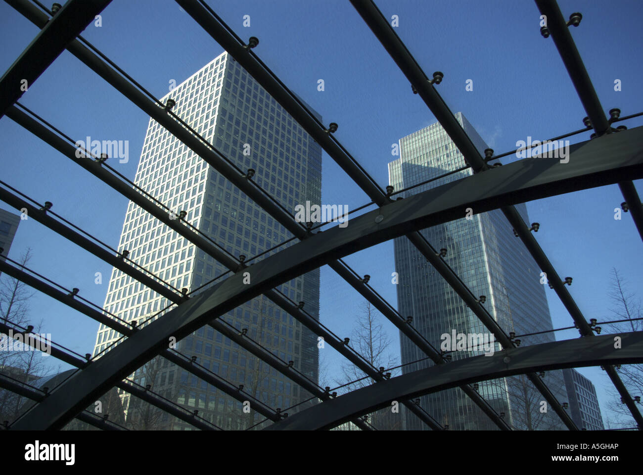 Canary Wharf London roof of Tube station and view through glass to 25 and 40 Bank Street Stock Photo
