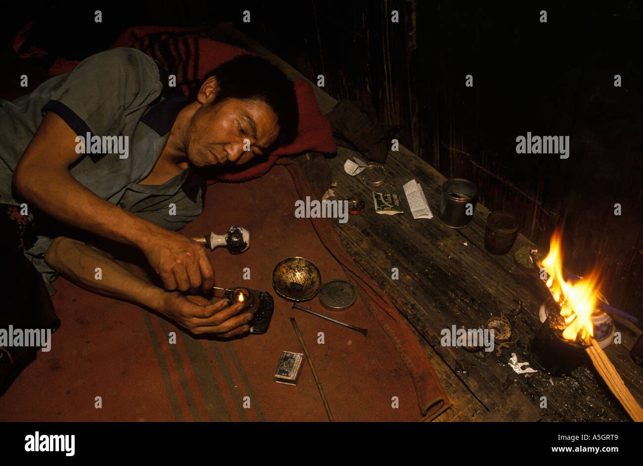 Opium addict, Drug  addiction tribesman Northern Thailand. South East Asia Chiang Rai province, 1990s 90s HOMER SYKES Stock Photo