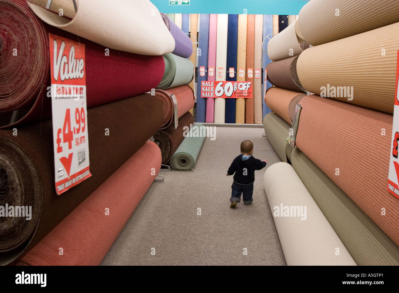 Carpets and rugs inside a carpet warehouse Stock Photo Alamy