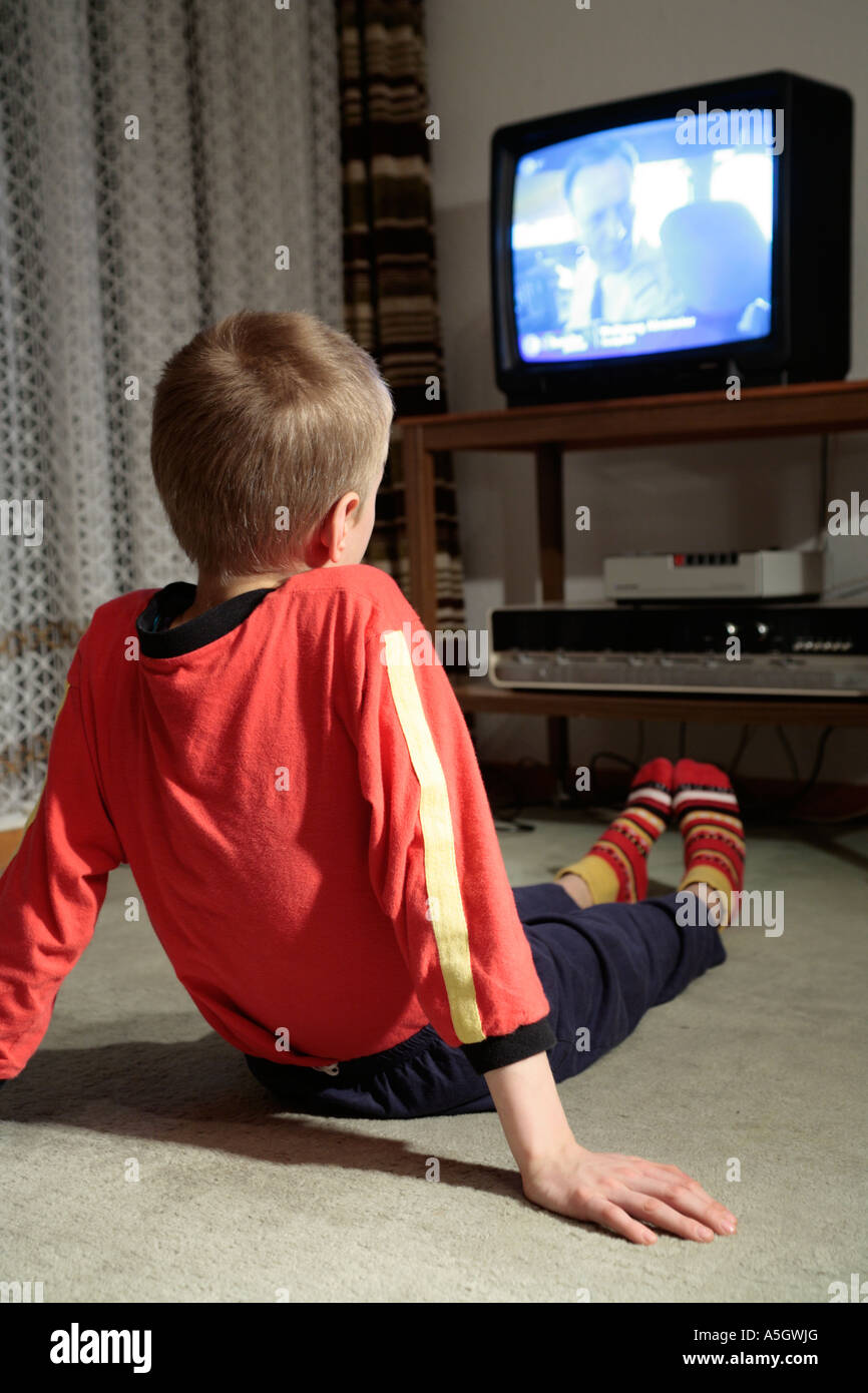 portrait of a young boy watching television Stock Photo Alamy
