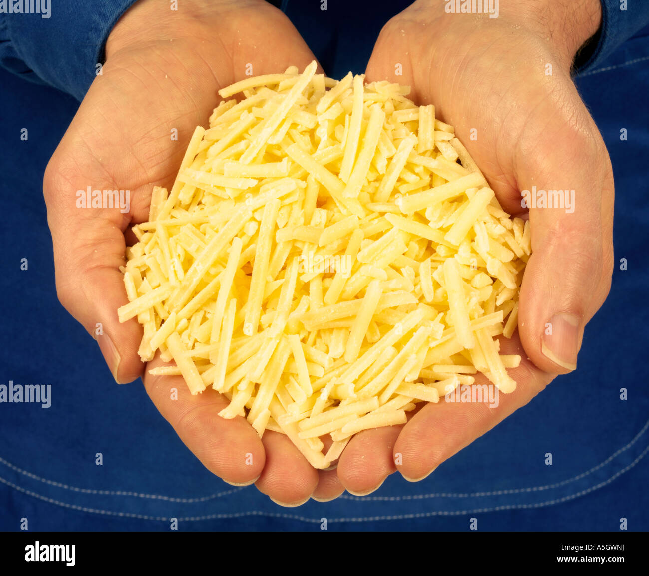 handful-of-grated-cheddar-cheese-stock-photo-alamy