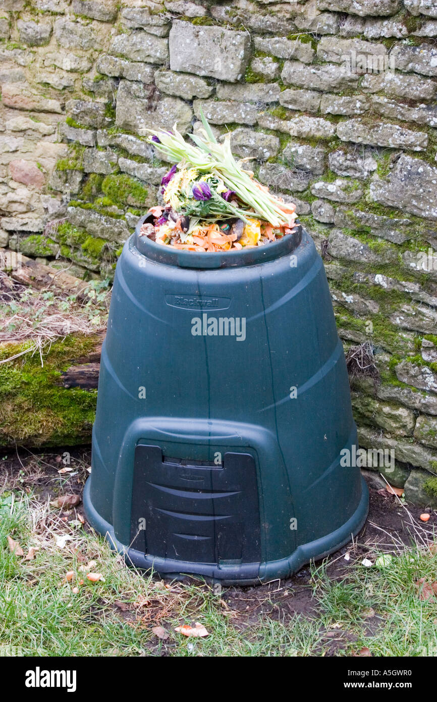 Compost bin containing rotting flowers and vegetables Stock Photo