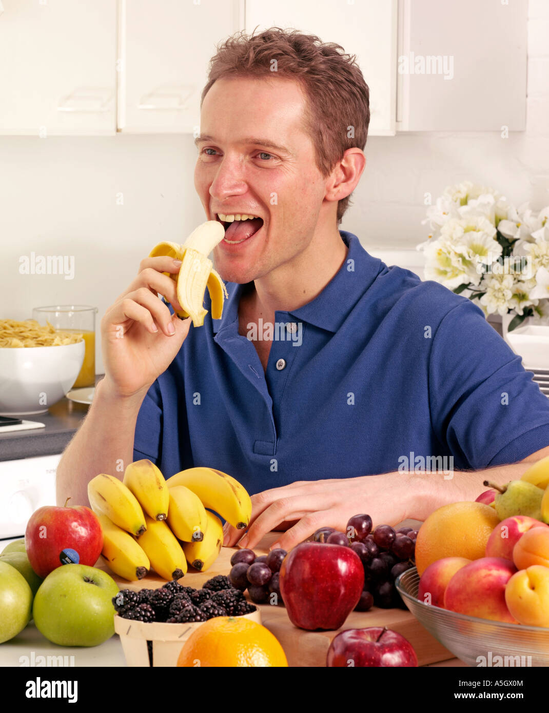 Man eating banana hires stock photography and images Alamy