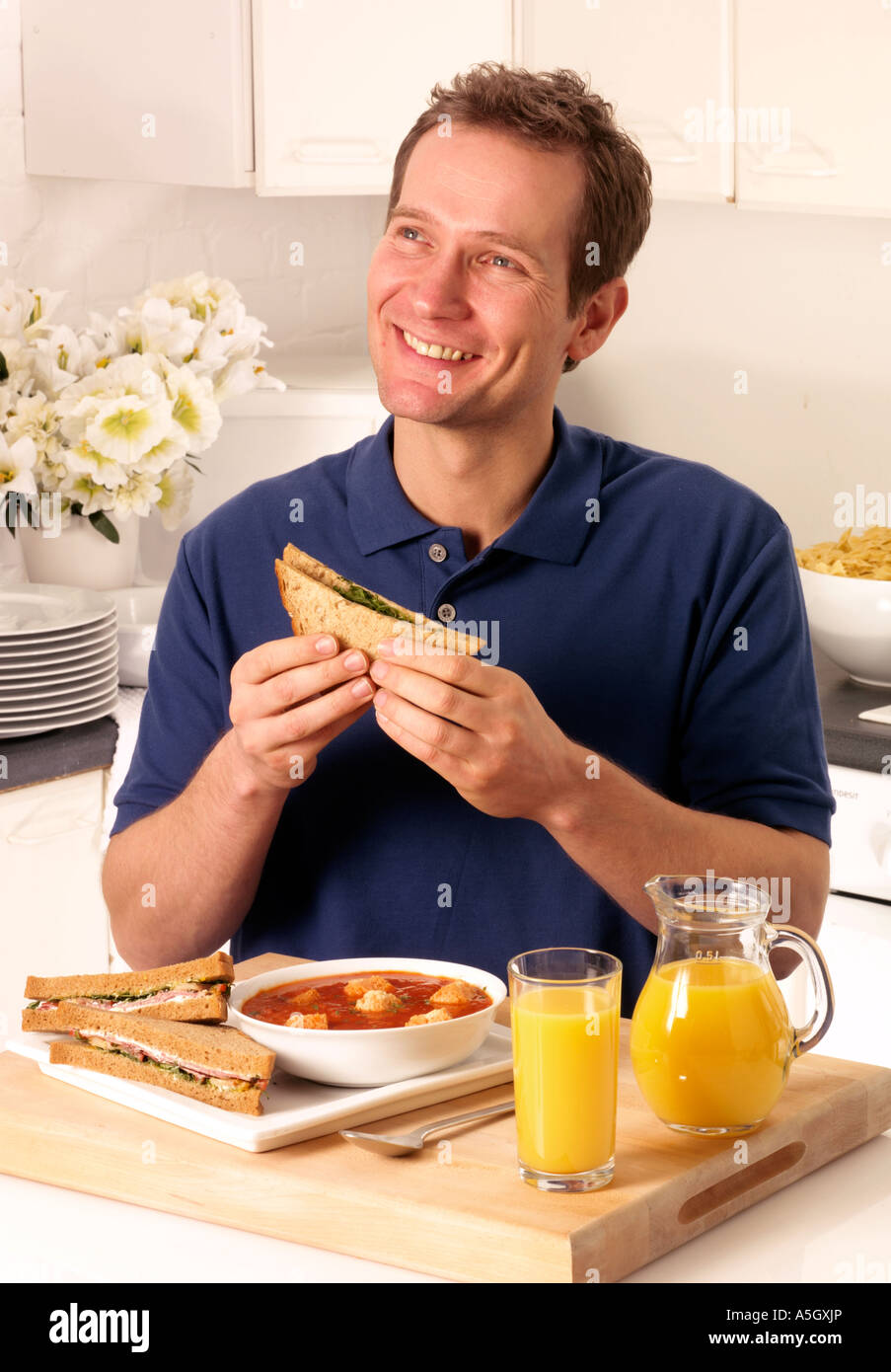 Young Man Eating a Freshly Made Sub Meat Feast San Stock Photo - Image of  holding, multi: 15576064