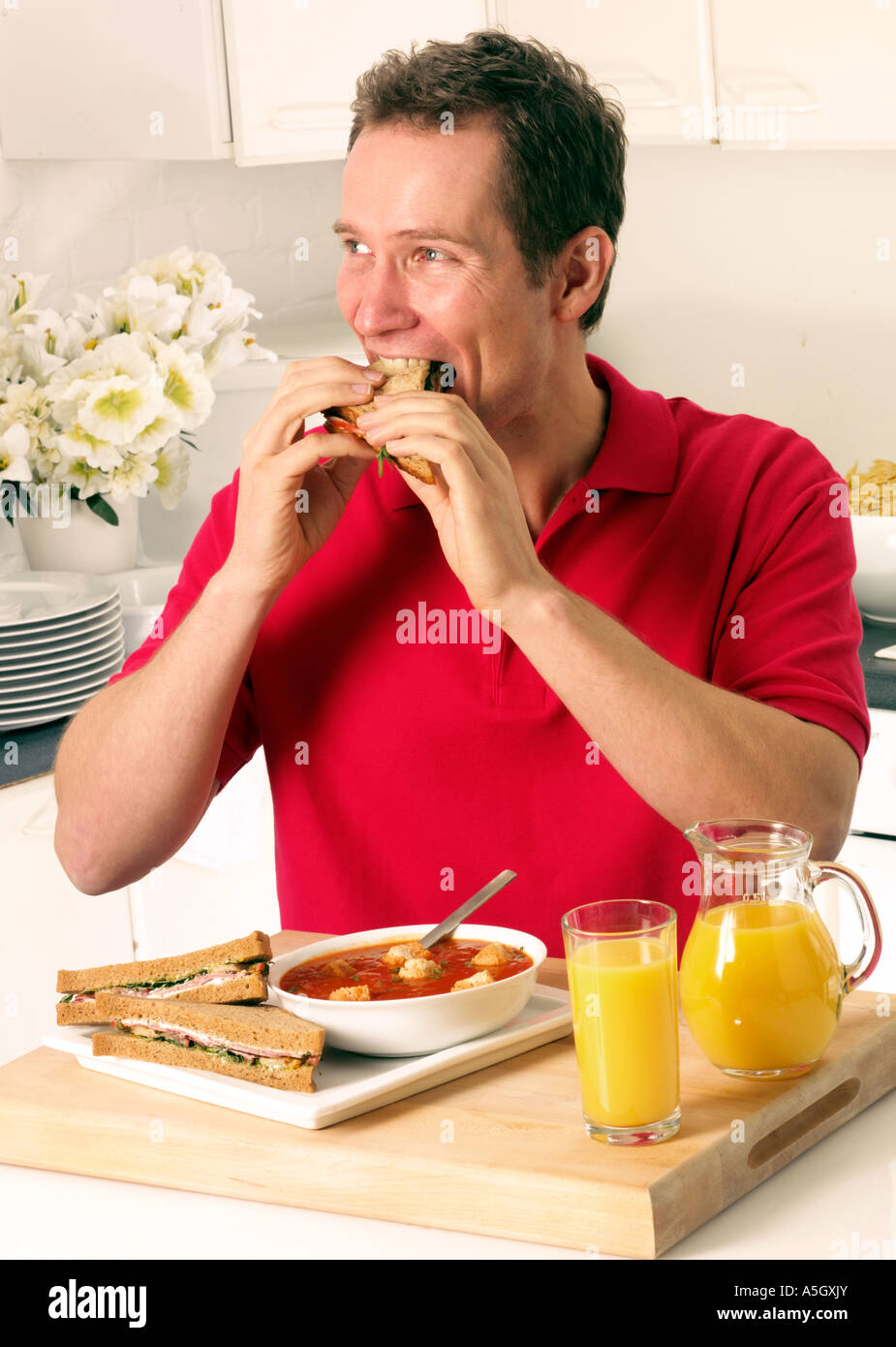 MAN EATING SANDWICH LUNCH Stock Photo Alamy