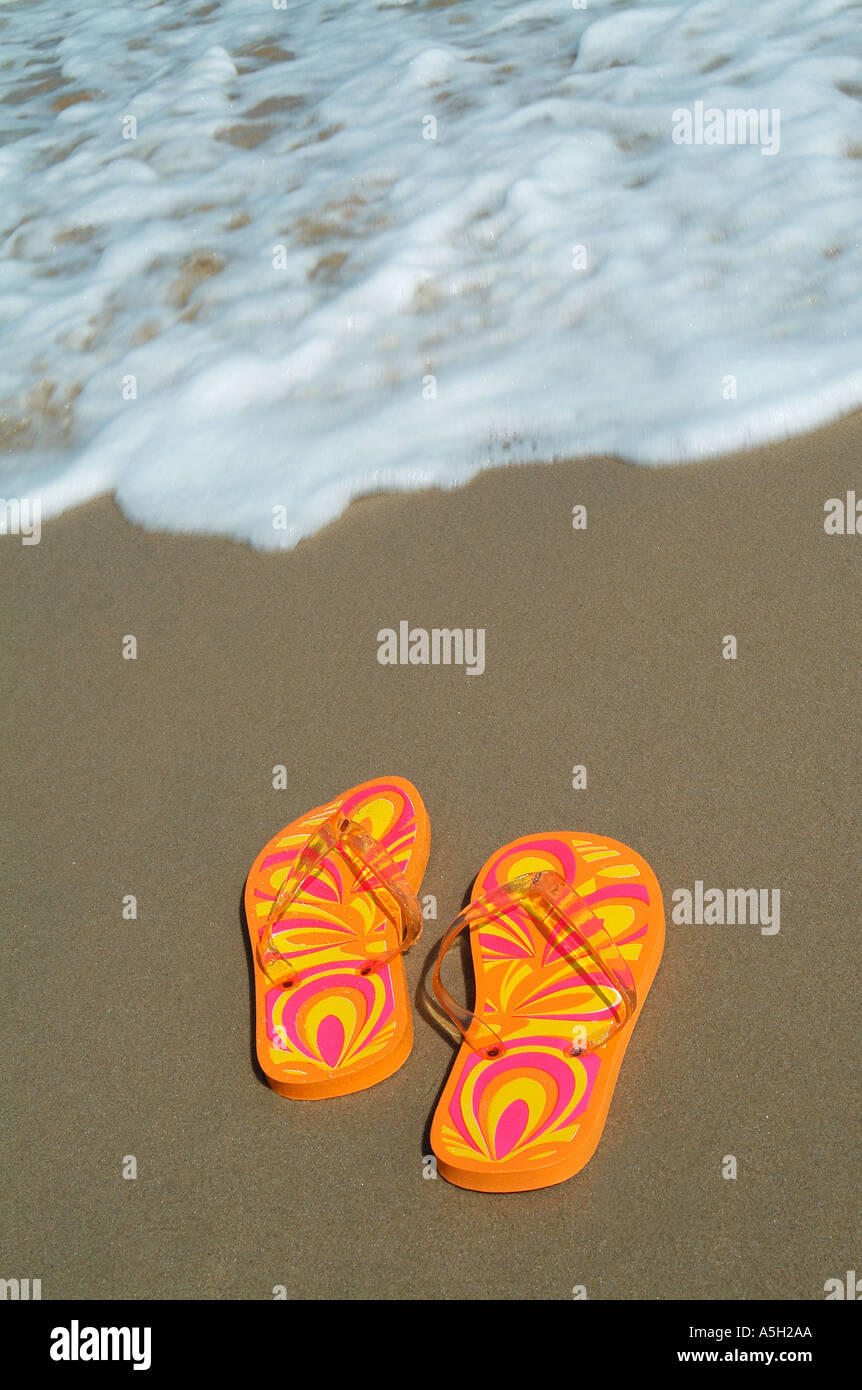 flip flops on sandy beach Stock Photo - Alamy
