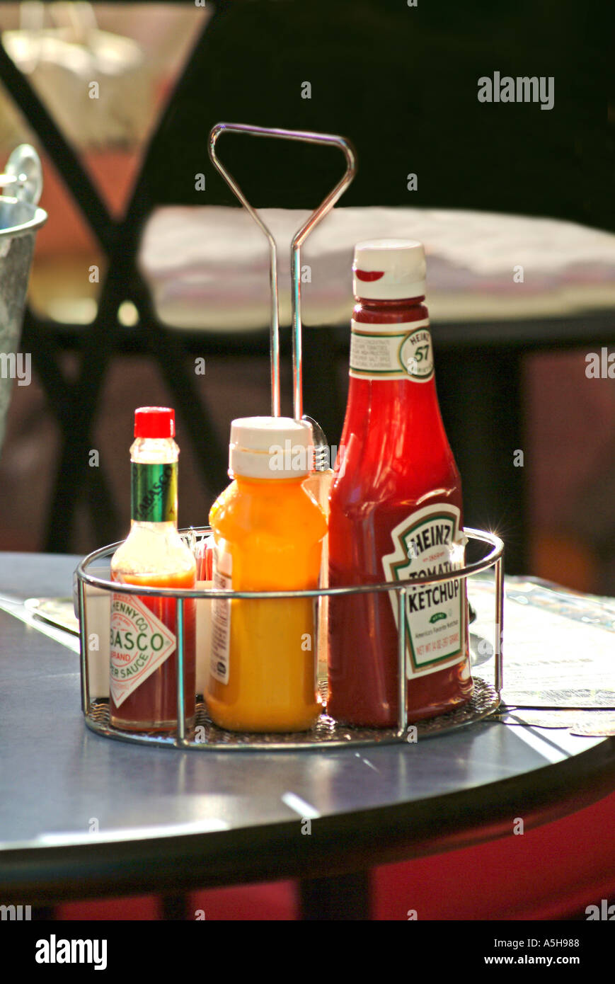 Outdoor restaurant table with condiments and food Stock Photo Alamy