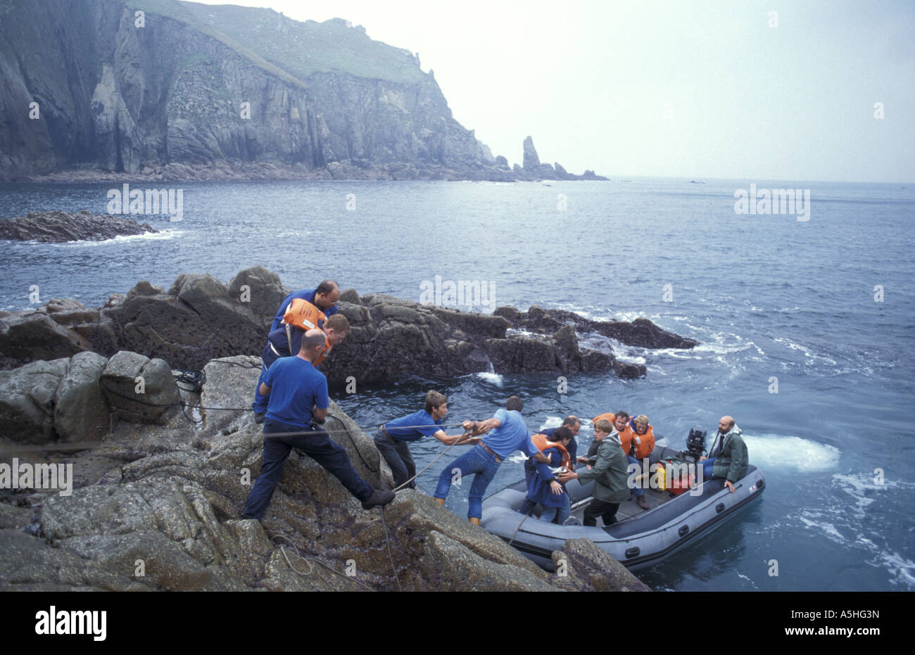 Visitors leaving Lundy Island from the West Coast Landing rocks a This