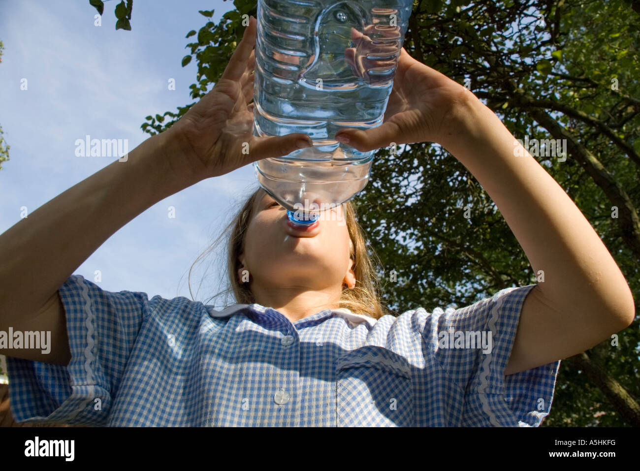 child drinking from mineral water bottle Stock Photo Alamy