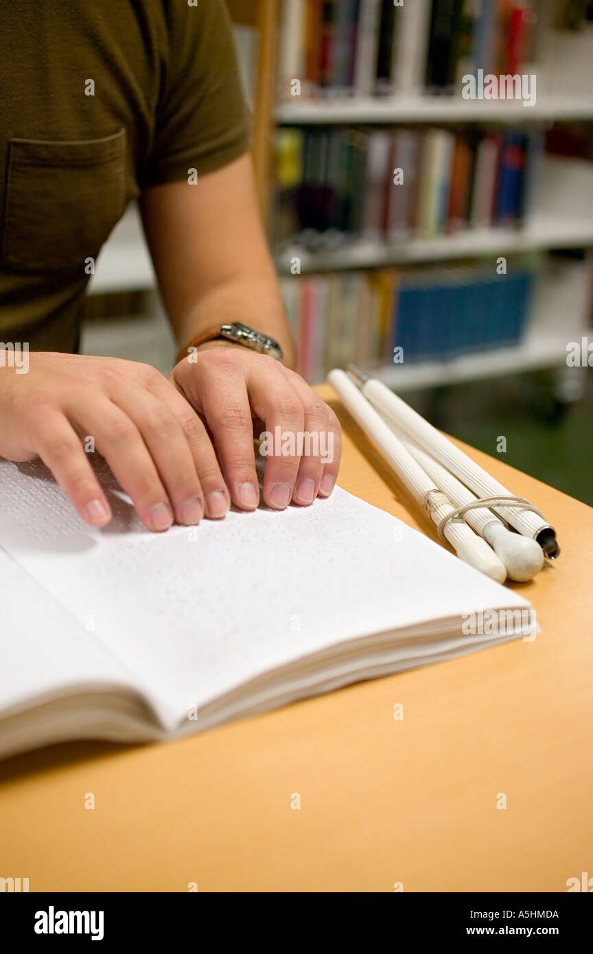 Young man reading braille Stock Photo