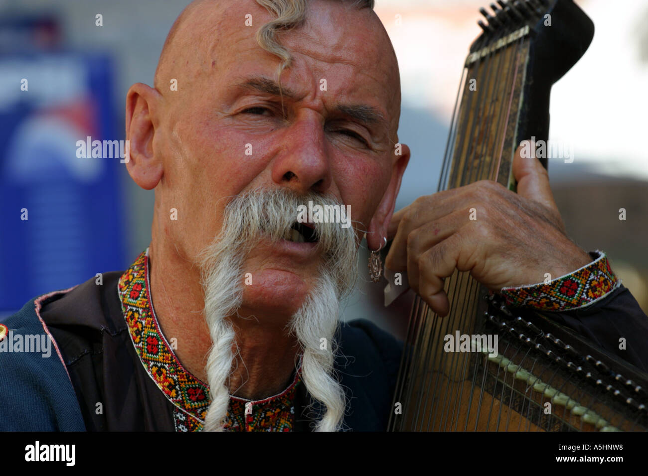 A street performer (cossack musician) on Long Market (Dluga Street) in Gdansk, Poland. Stock Photo
