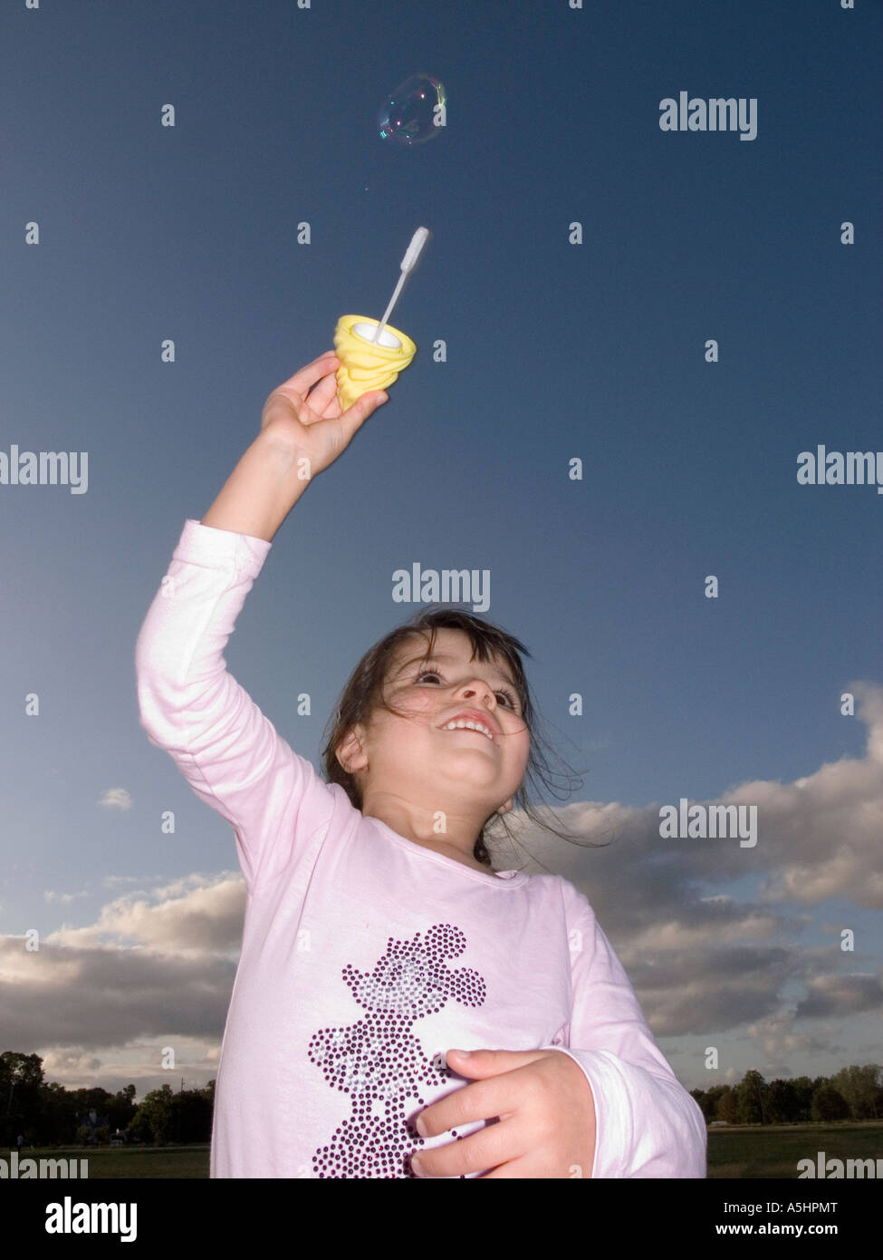 child playing with soap-bubbles in the park Stock Photo - Alamy