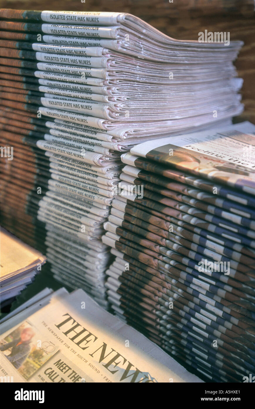 STACKS OF NEWSPAPERS AT NEWSSTAND SEATTLE  WASHINGTON USA Stock Photo