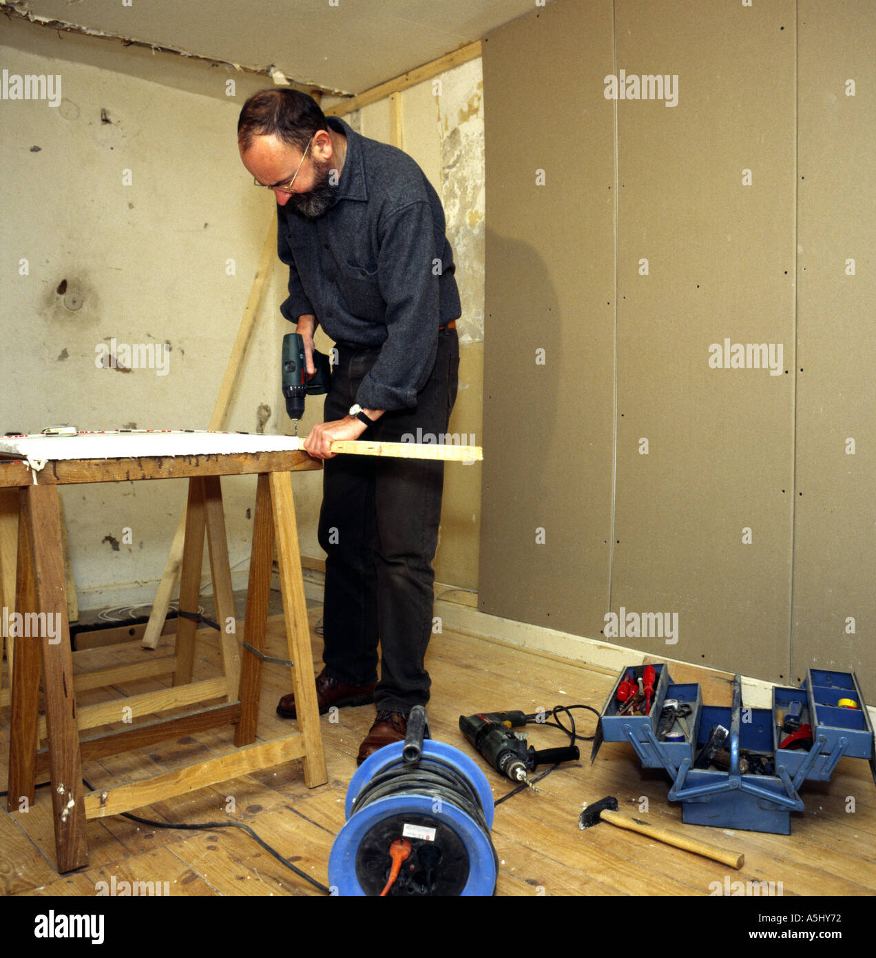 MR PR handyman do it yourselfer renovating a flat Stock Photo