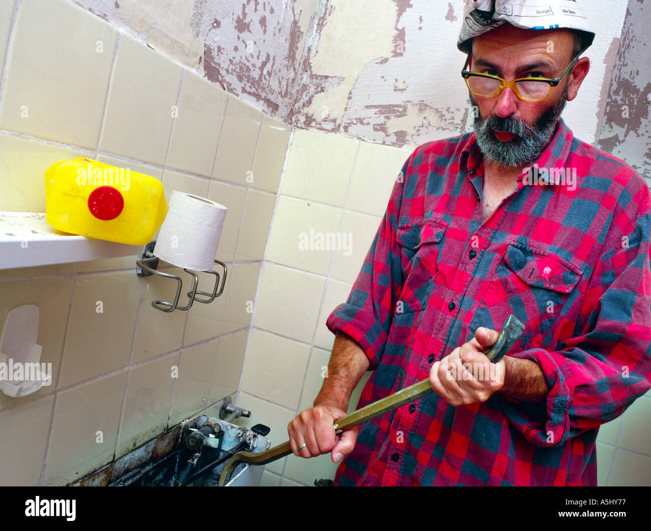 MR PR handyman do it yourselfer renovating a flat looking silly Stock Photo