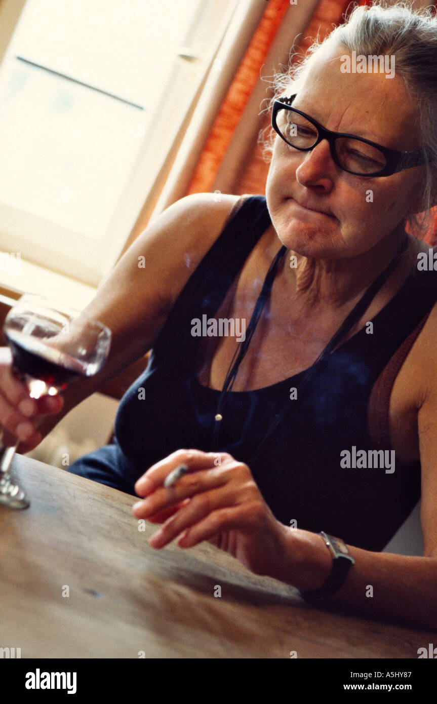 woman-drinking-glass-wine-cigarette-hi-res-stock-photography-and-images