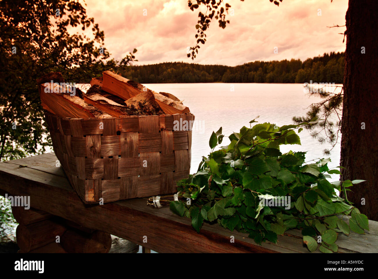 PR basket filled with firewood and branches of birches prepared for
