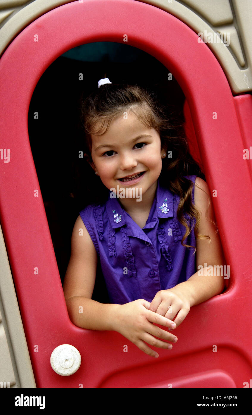 Little girl in playhouse Stock Photo Alamy