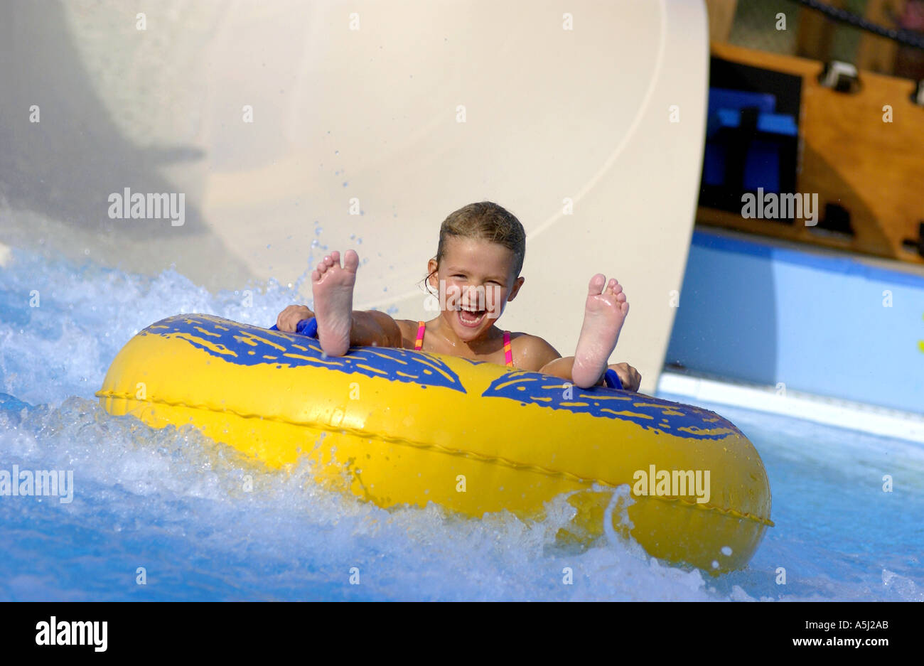 Kid going down water slide on a tube Stock Photo 2089642 Alamy