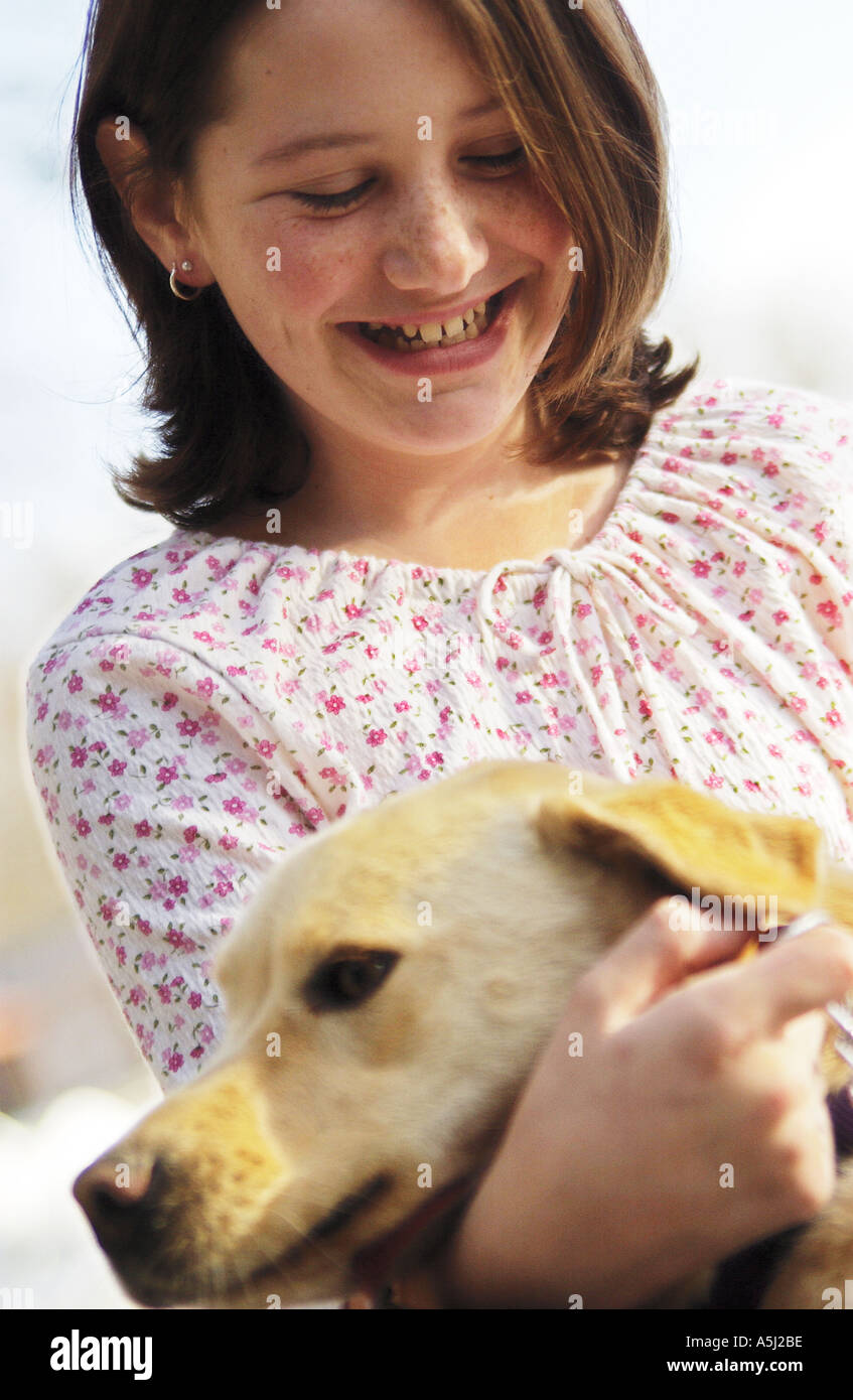 Girl hugging dog Stock Photo - Alamy