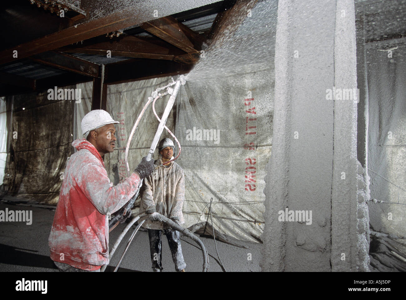 Spraying fireproofing on steel for new Random House building at 1745 Broadway  in New York City. Stock Photo