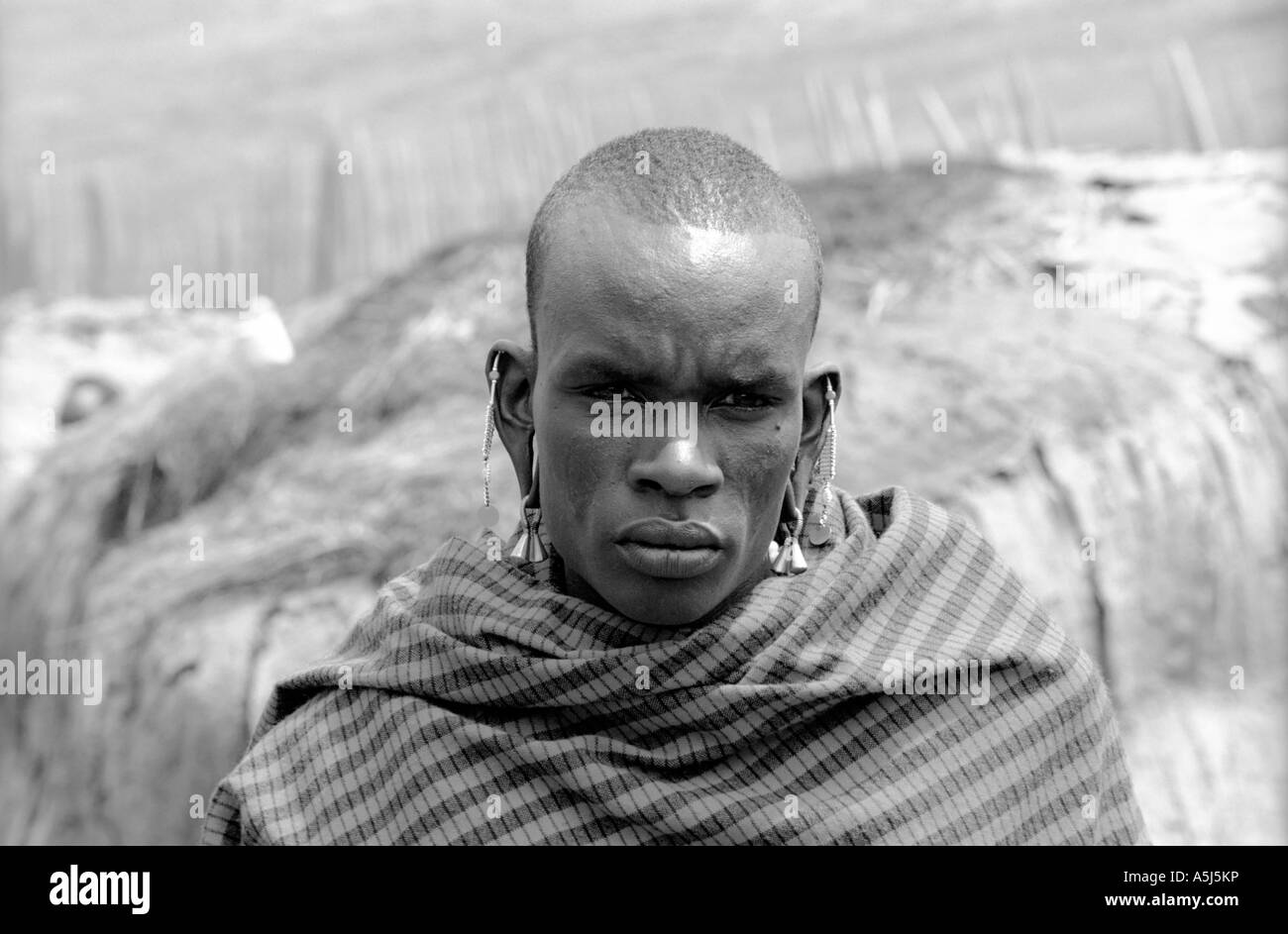 Masai man in traditional dress Black and White Stock Photos & Images ...