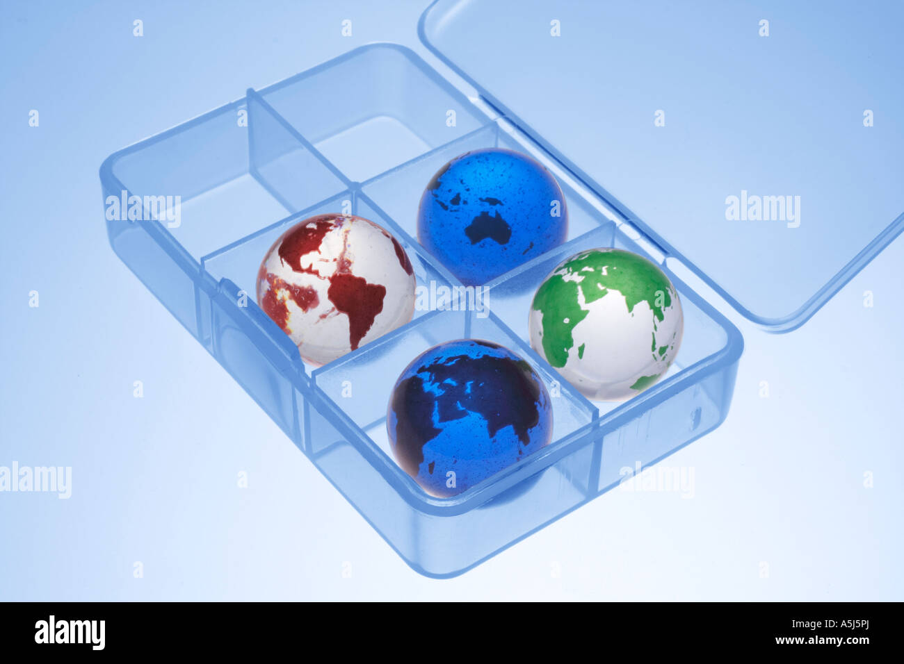Globe Marbles in Plastic Container Stock Photo Alamy