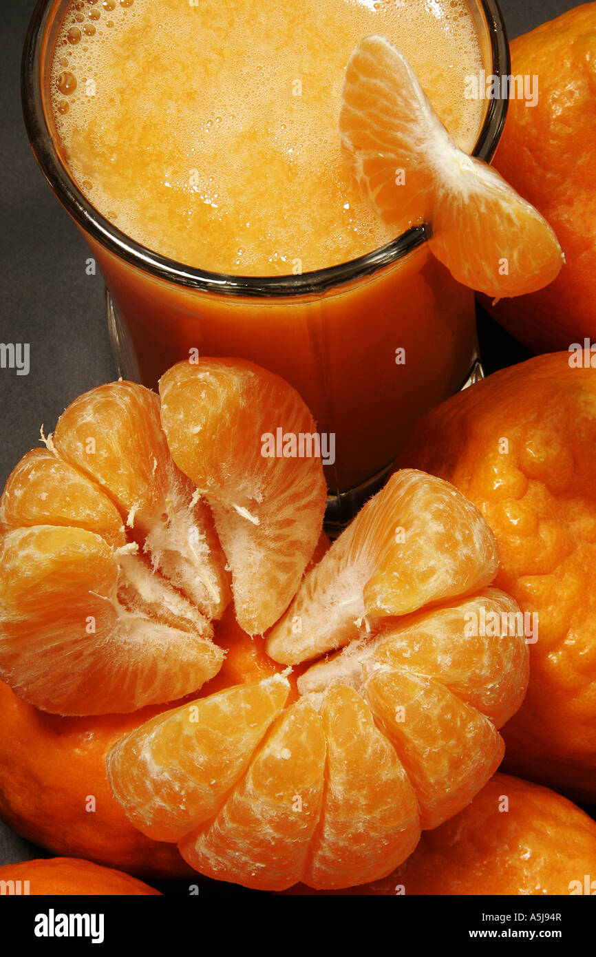 Fruit one unpeeled oranges piece glass orange juice table top studio