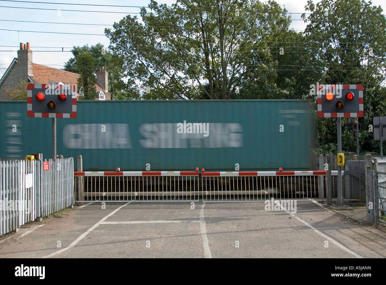 Railway Tracks Red Flashing Warning Light Sign Level Crossing Barrier Gates Country Road Container Train Motion Blur Margaretting Essex England Uk Stock Photo Alamy Railway Tracks Red Flashing Warning Light Sign Level Crossing Barrier Gates Country Road Container Train Motion Blur Margaretting Essex England Uk Stock Photo Alamy