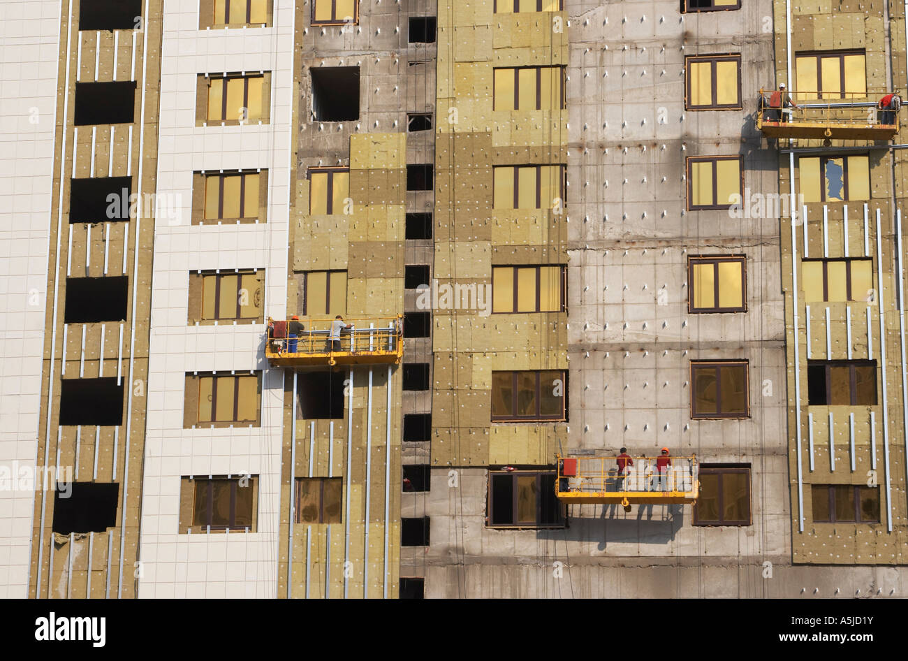 Construction Workers On Cradle Stock Photo - Alamy