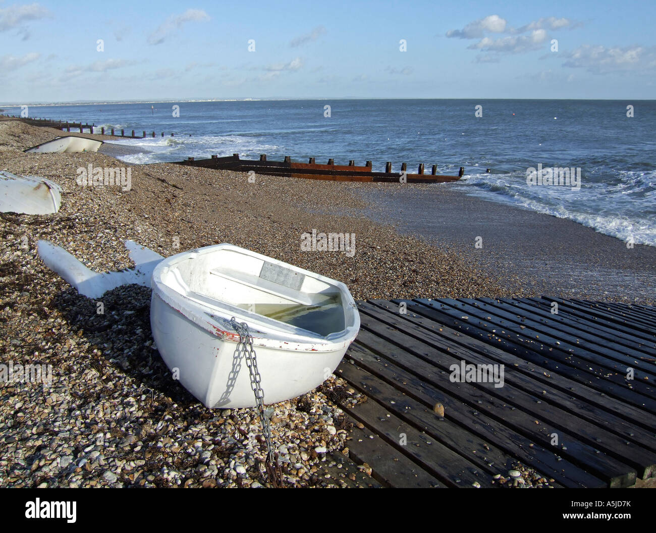 Boat next to the wooden slip way at Selsey East Beach, West Sussex ...