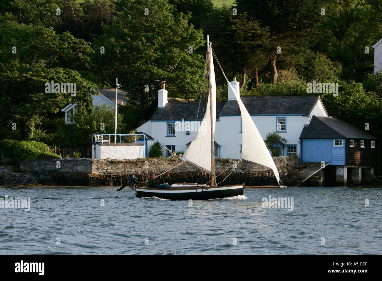 traditional wooden yacht sailing in falmouth harbour uk Stock Photo Alamy