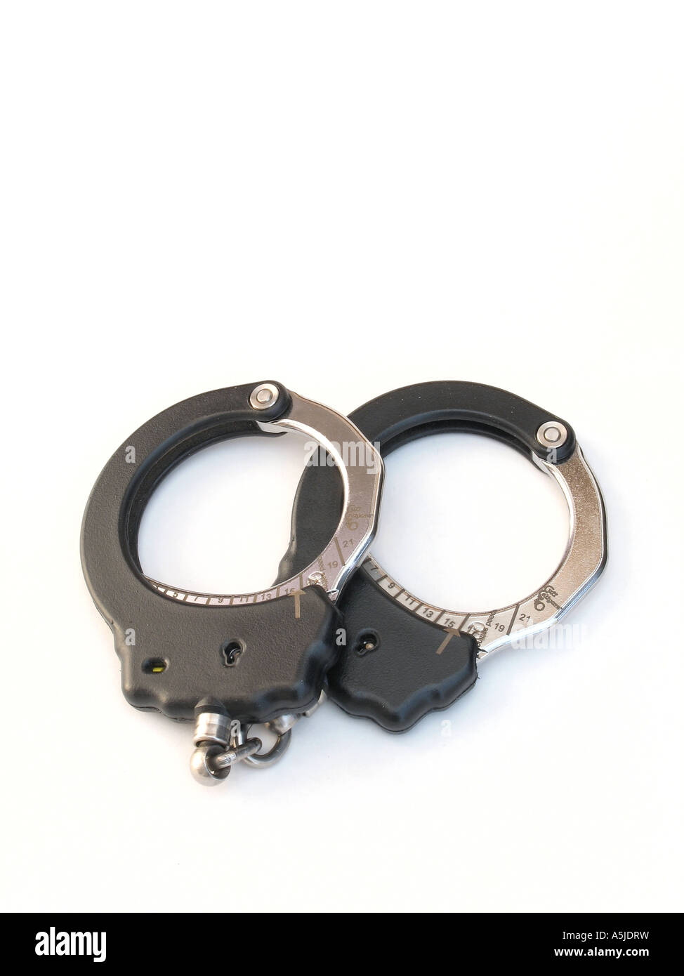 A pair of black ASP tactical police handcuffs Stock Photo