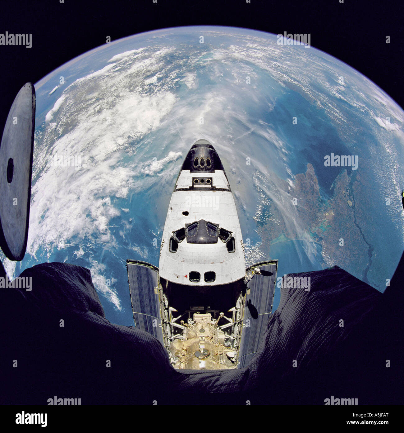Fish-eye view of the Space Shuttle Atlantis as seen from the Russian Mir space station.  Date: 06/29/1995 Stock Photo