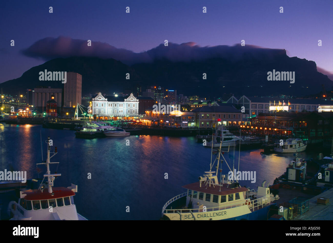 the waterfront and Table Mountain at dusk Capetown South Africa Stock Photo