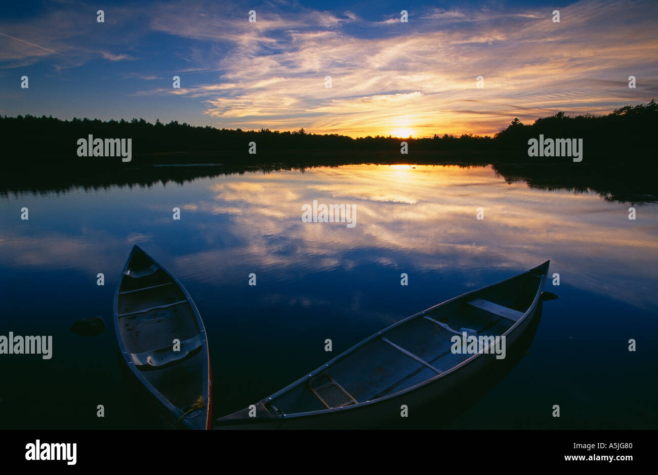 canoes on the Mersey River at dusk nr Kejimkujik National Park Nova