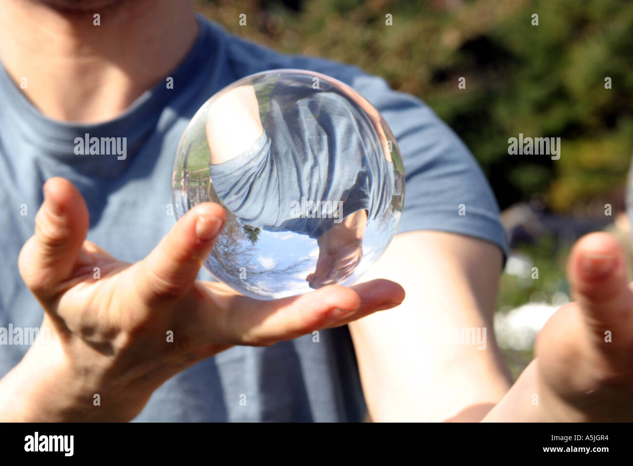 Contact juggler, juggling with glass ball Stock Photo Alamy