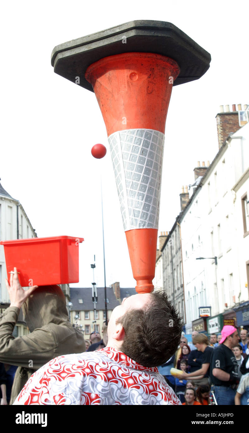 juggler balancing traffic cone Stock Photo - Alamy