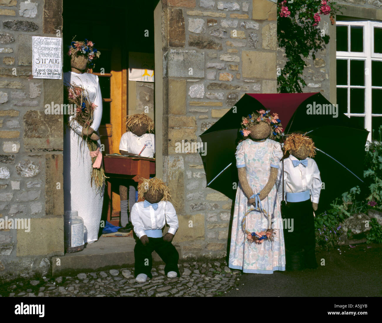 Wedding scarecrows, Scarecrow Festival, Kettlewell, Wharfedale, Yorkshire Dales National Park, North Yorkshire, England, UK. Stock Photo