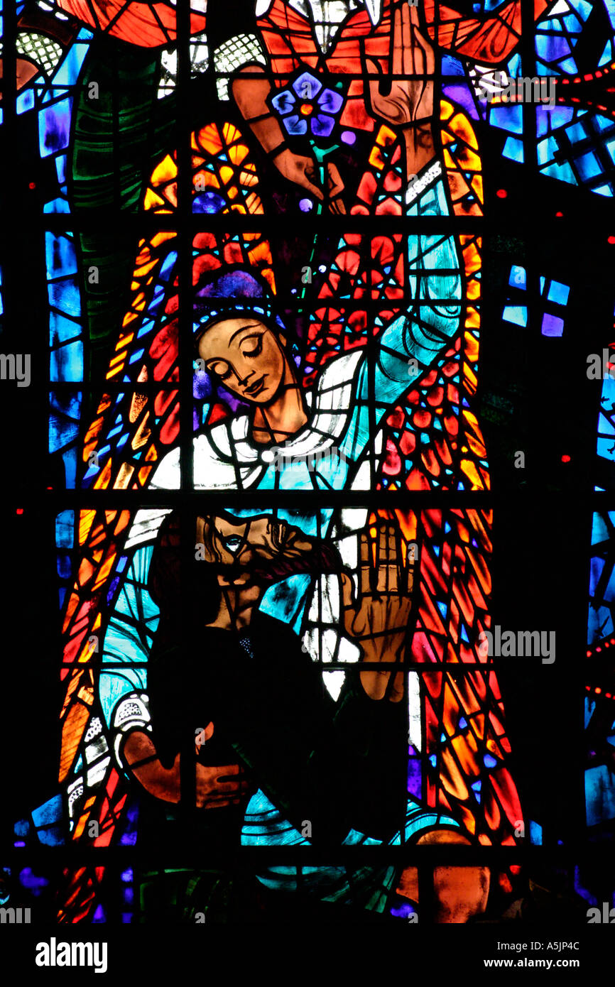 Detail of a Stained Glass Window by Ervin Bossanyi depicting salvation and deliverance from evil Stock Photo
