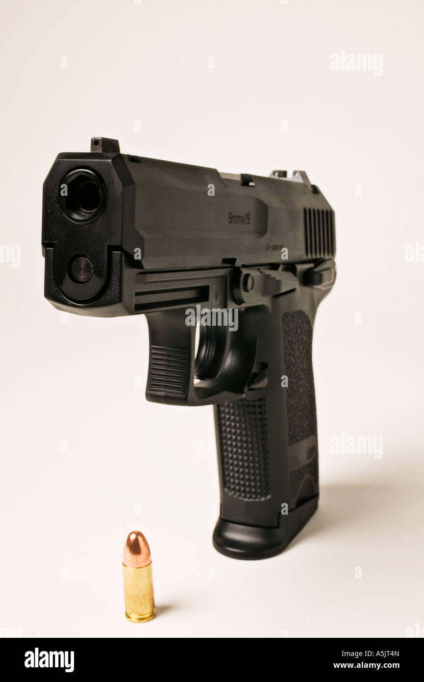 9mm handgun with bullet Stock Photo