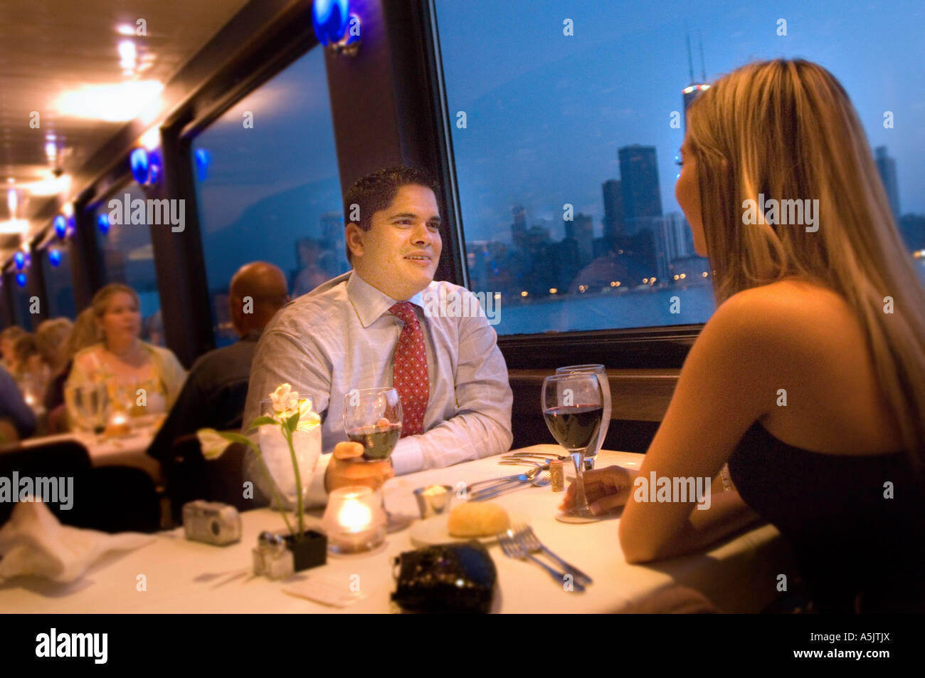 Couple enjoying a Dinner Cruise on the Odyssey in Chicago Illinois Stock Photo