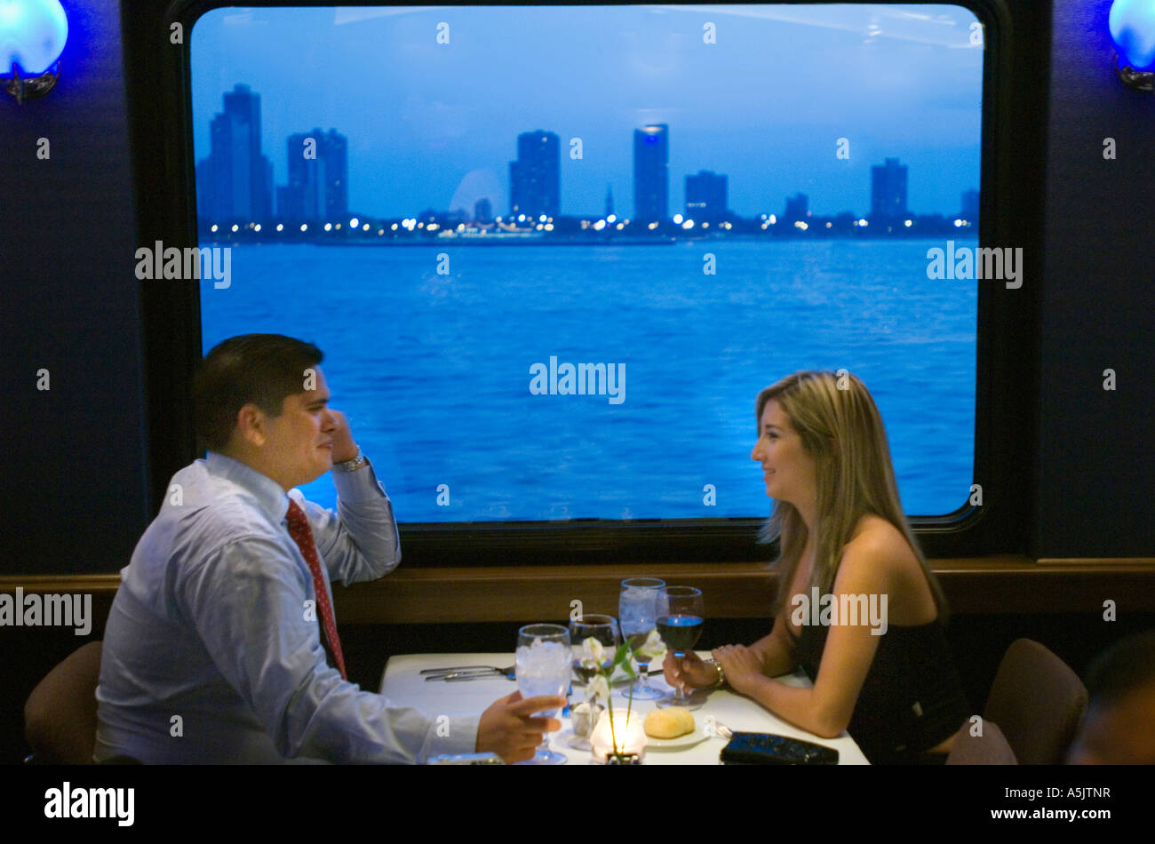 Couple enjoying a Dinner Cruise on the Odyssey in Chicago Illinois Stock Photo