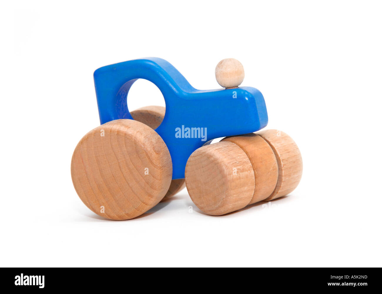 Wooden toy tractor on white background Stock Photo - Alamy