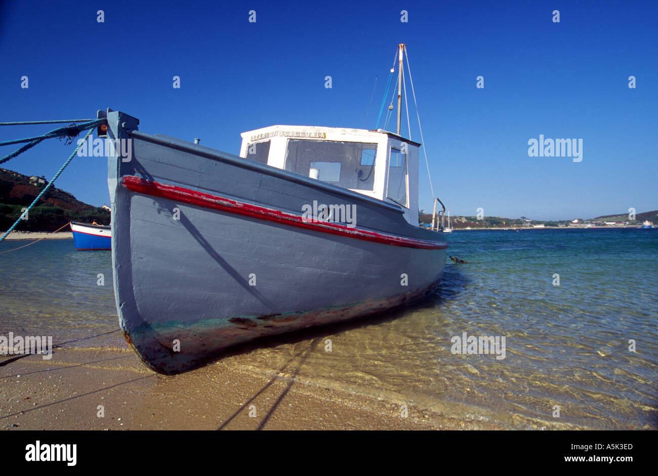 Boat on the beach Bryher Isles of Scilly Cornwall UK Stock Photo