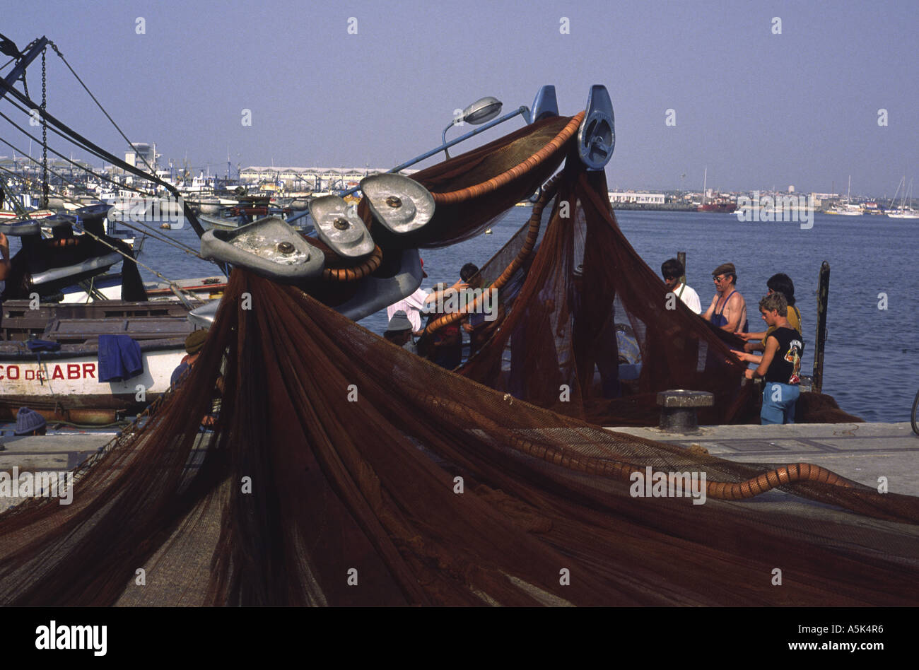 Working in sardine nets, Peniche, Portugal Stock Photo