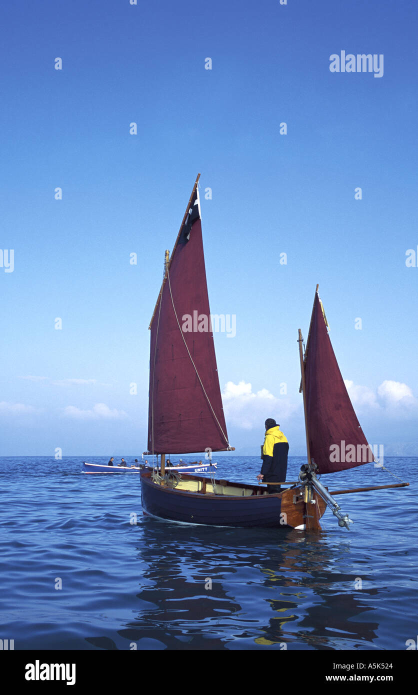 Replica of a Cornish fishing lugger off the north coast of Cornwall Port Isaac near Padstow Cornwall Great Britain Stock Photo