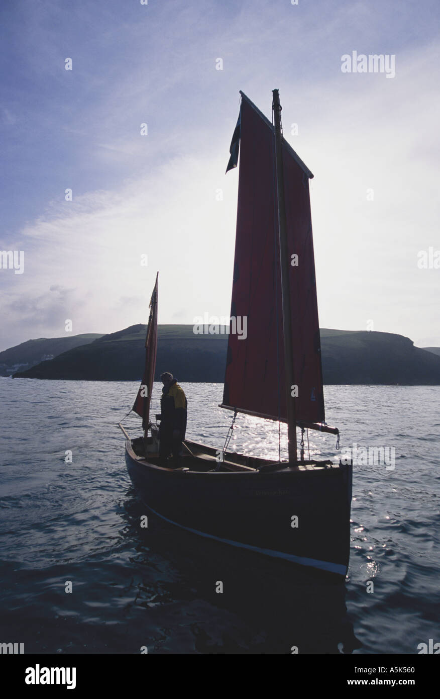 Replica of a Cornish fishing lugger off the north coast of Cornwall Port Isaac near Padstow Cornwall Great Britain Stock Photo