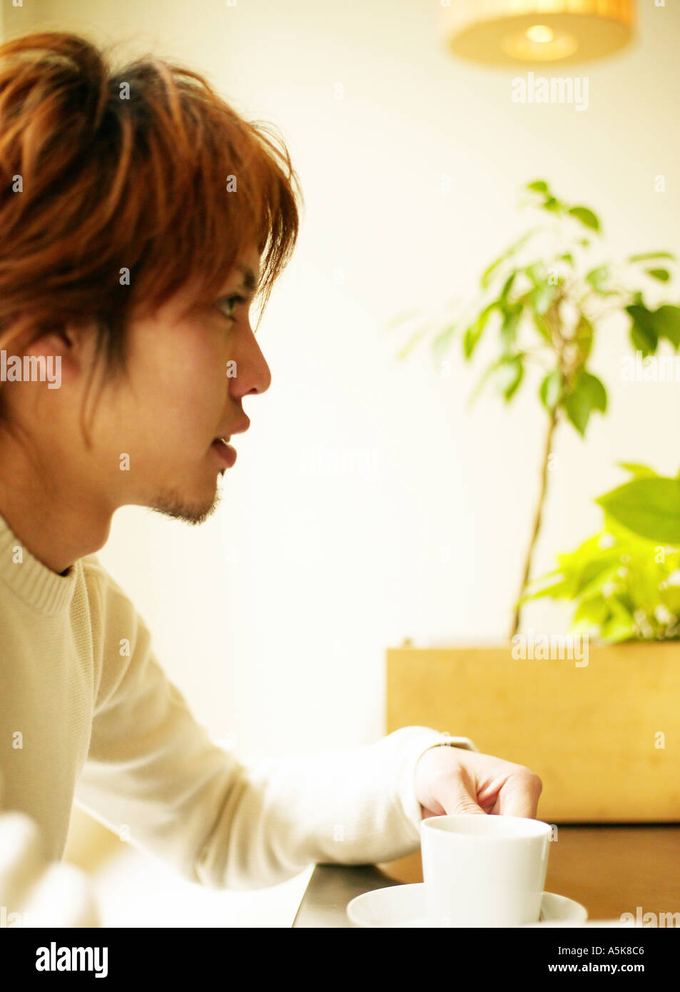 Young man with coffee cup Stock Photo